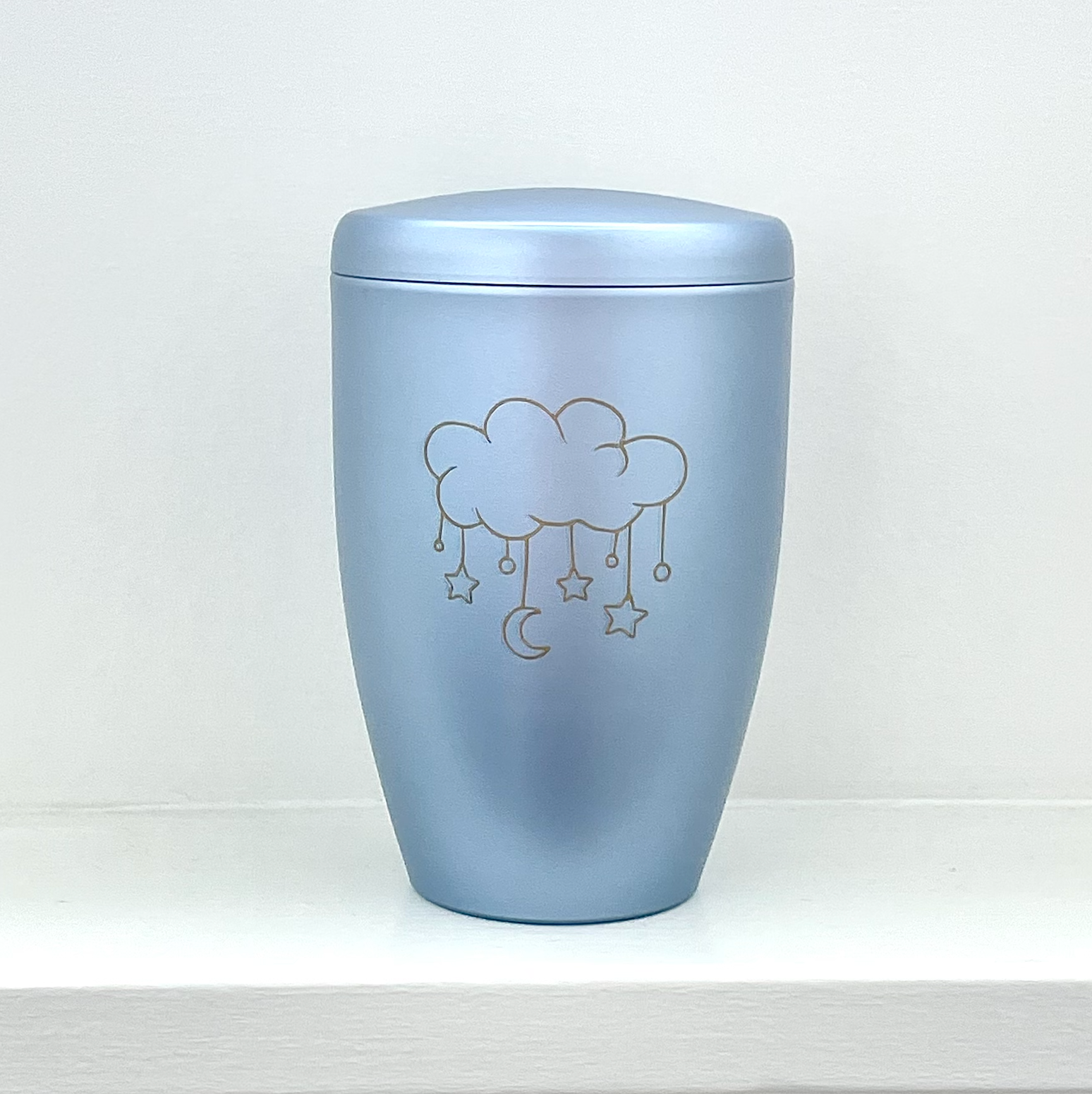 Light blue infant urn with cloud and dangling stars and moon