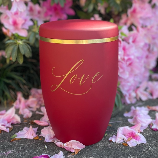 Red Cremation urn with the word love in golden lettering