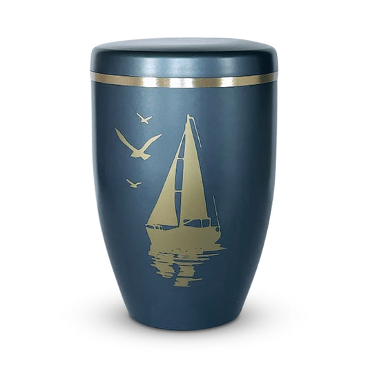 stunning blue urn for ashes with a sailing boat