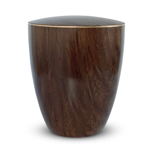 Beautiful dark wood cremation urn with a delicate golden ring.