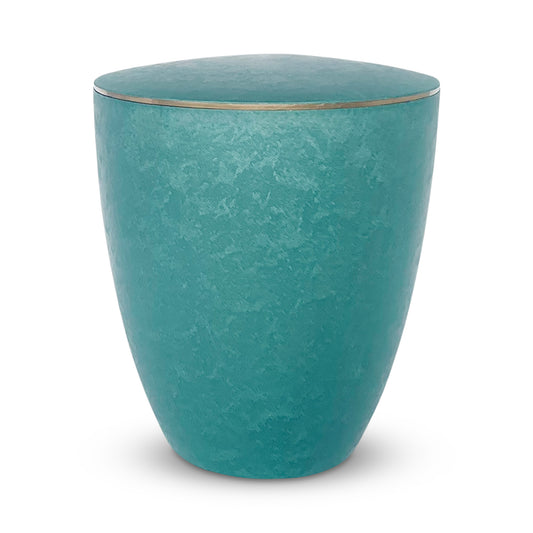 Stunning emerald green cremation urn with an elegant golden band around the lid.