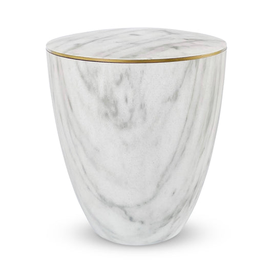 Beautiful marble imitation urn for ashes with a delicate gold ring.