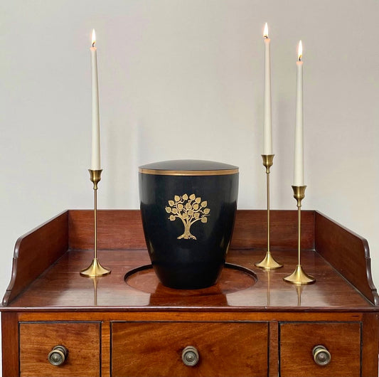 Beautiful black urn for ashes engraved and hand-painted with the sacred symbol of a golden Tree of Life.