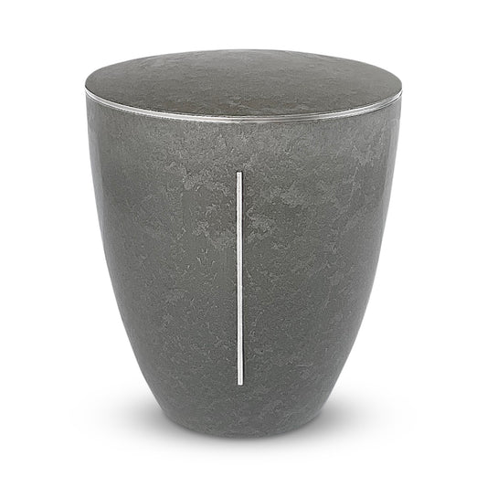 Elegant and sculptural stone coloured cremation urn with a silver pillar of light symbol.