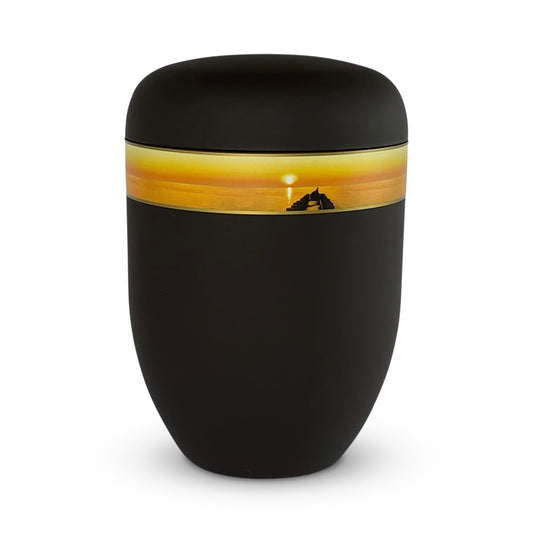 Beautiful black funeral urn with photo band of an atmospheric sunset by a jetty.