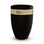 Elegant black funeral urn with a beautiful natural coloured band of delicate black falling leaves.