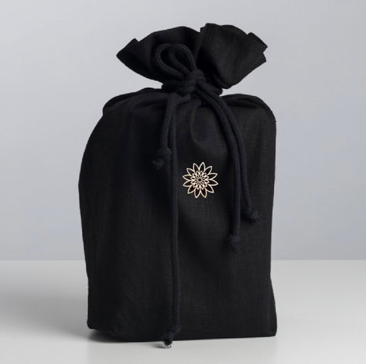 Simple and beautiful black fabric urn for ashes made of the finest ecological Italian linen and adorned with a delicate wooden ornament. 