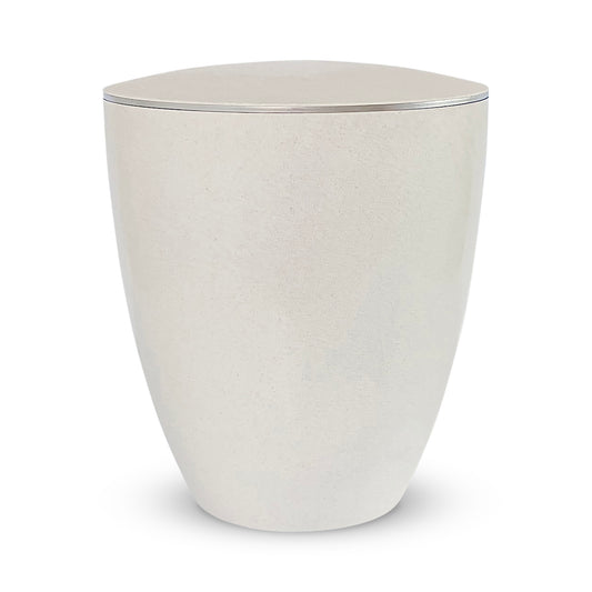 Elegant off-white urn for ashes with a delicate silver ring.