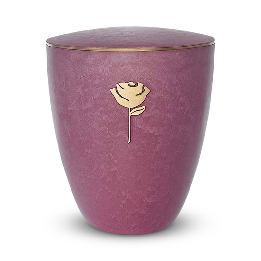 Vibrant rose coloured cremation urn with an elegant golden rose symbol and delicate gold ring around the lid.