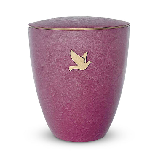 Beautiful vibrant rose coloured crematin urn with a symbol of an elegant golden dove.