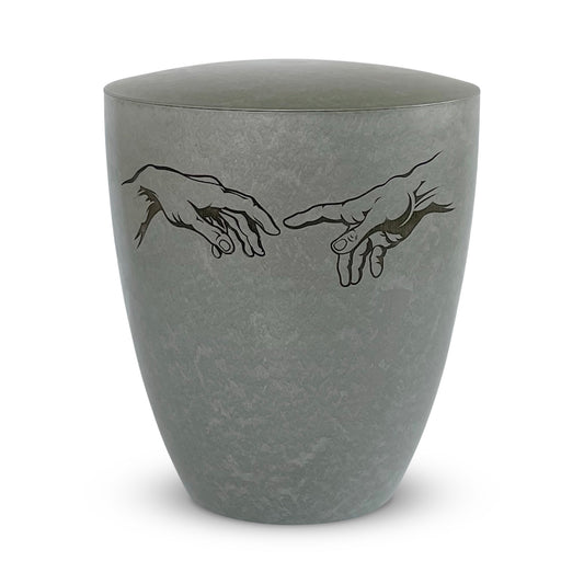 Stunning silver grey urn for ashes with engraving of Michelangelo's famous hands of God and Adam.