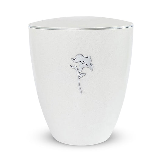 Elegant off-white urn for ashes with a delicate silver lily.