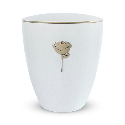 Elegant off-white urn for ashes with a beautiful golden rose and delicate golden band around the lid.
