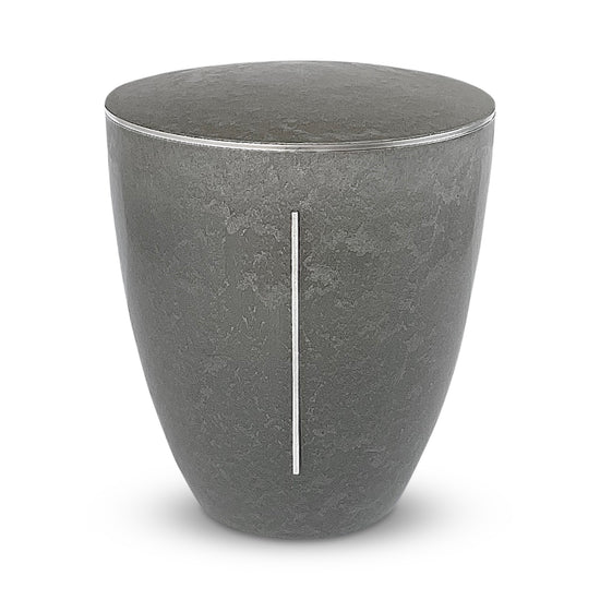 Elegant and sculptural stone coloured cremation urn with a silver pillar of light symbol.